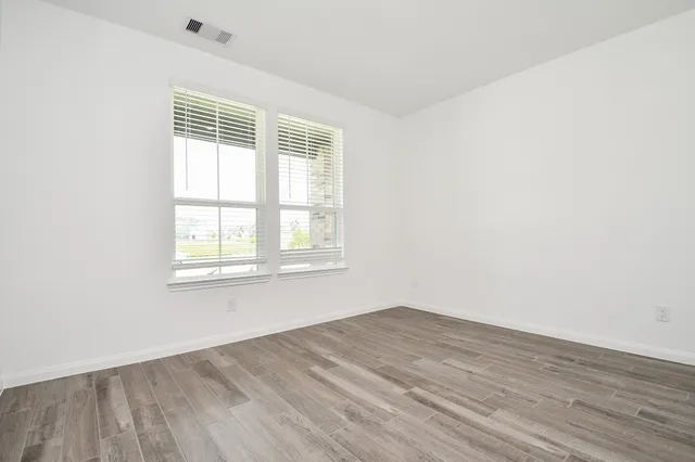 a bathroom with a sink toilet vanity and shower