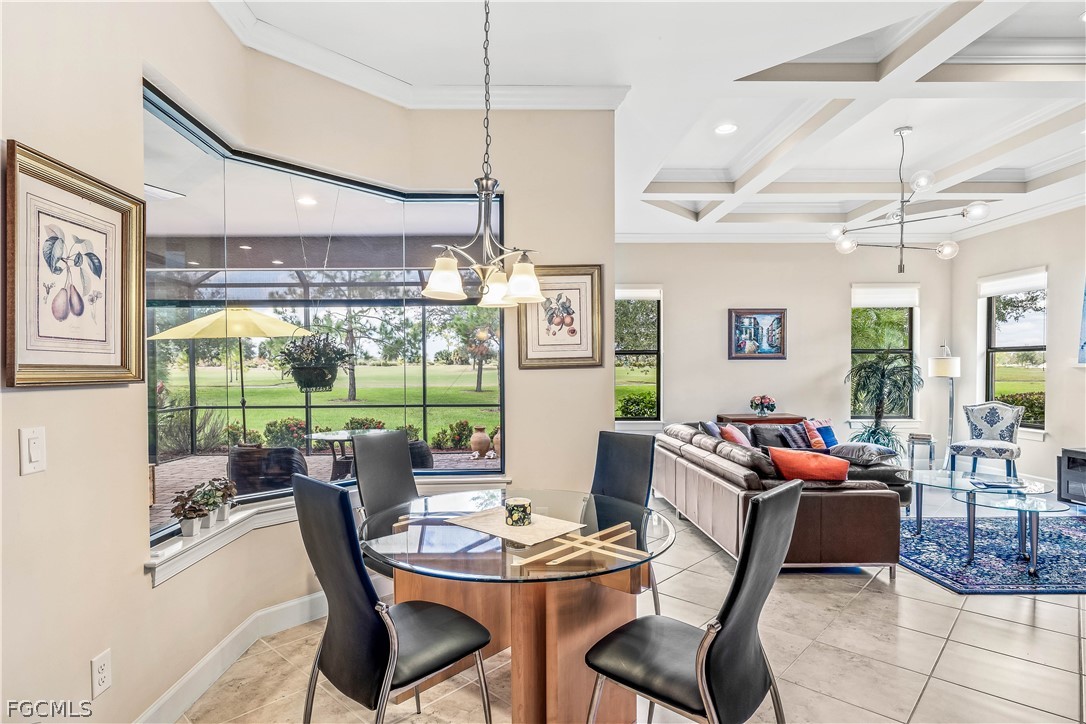 3341 Chestnut Grove Drive Alva, FL 33920 - Photo 12 of 44 a dining room with furniture a chandelier and windows