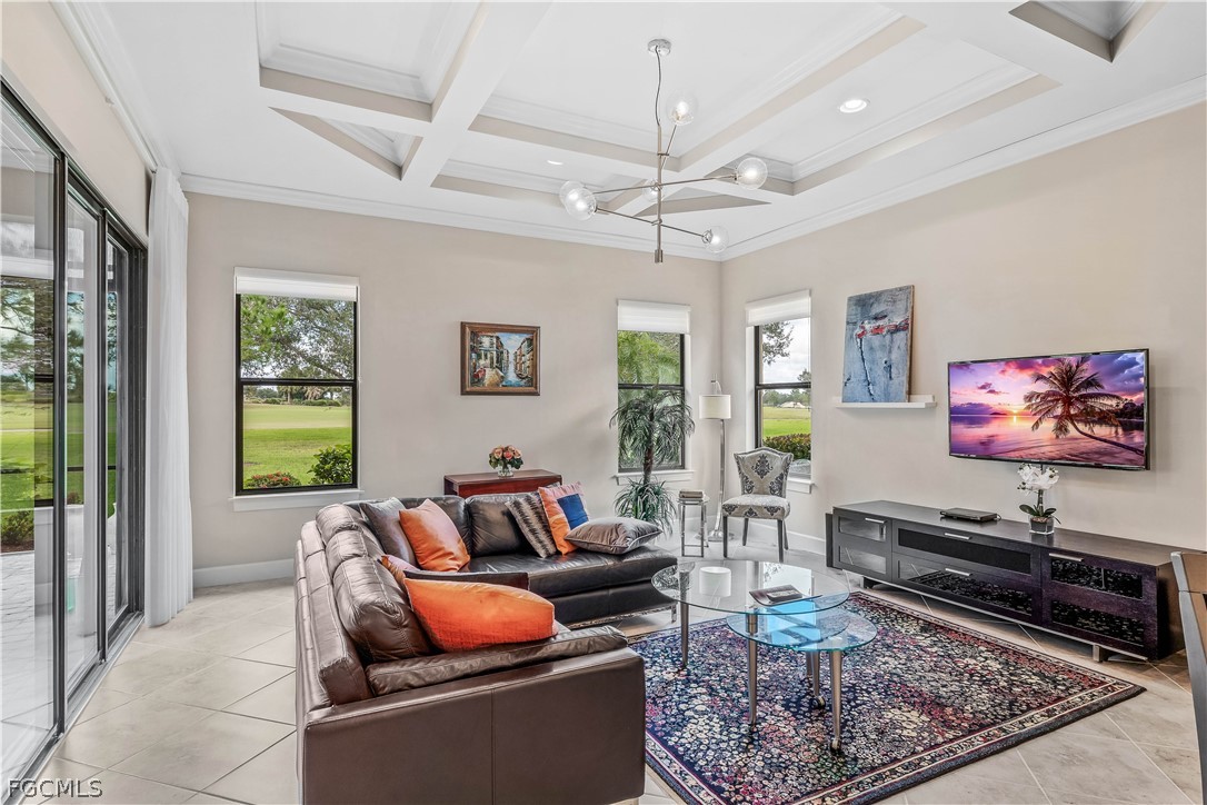 3341 Chestnut Grove Drive Alva, FL 33920 - Photo 13 of 44 a living room with furniture a rug and a flat screen tv