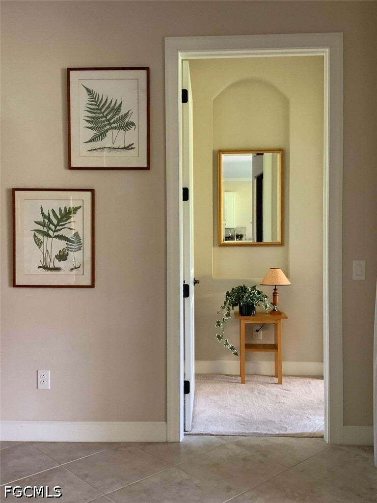 3341 Chestnut Grove Drive Alva, FL 33920 - Photo 17 of 44 a view of a hallway with chairs