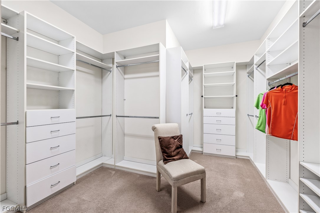 3341 Chestnut Grove Drive Alva, FL 33920 - Photo 20 of 44 a view of walk in closet with clothes and shoes