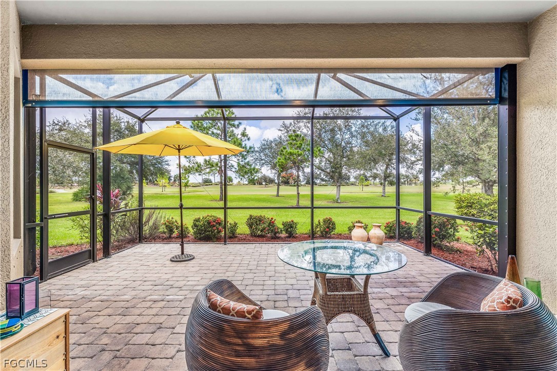 3341 Chestnut Grove Drive Alva, FL 33920 - Photo 25 of 44 a view of a swimming pool with a patio and a yard