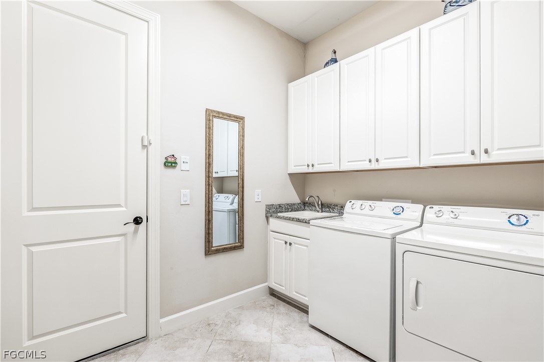 3341 Chestnut Grove Drive Alva, FL 33920 - Photo 29 of 44 a utility room with dryer and washer