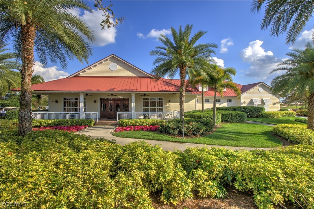 3341 Chestnut Grove Drive Alva, FL 33920 - Photo 35 of 44 a front view of a house with swimming pool having outdoor seating