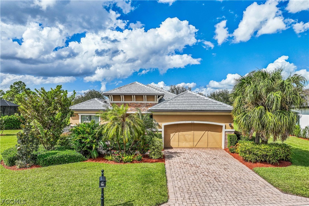 3341 Chestnut Grove Drive Alva, FL 33920 - Photo 5 of 44 a front view of a house with garden