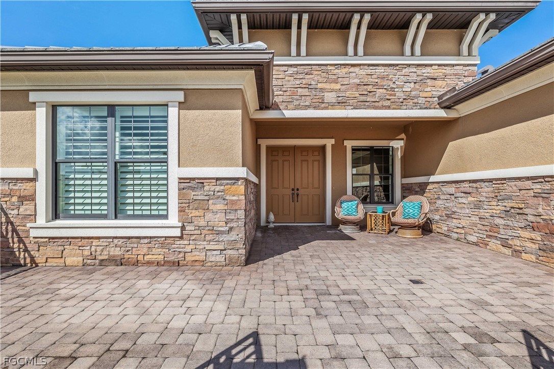 3341 Chestnut Grove Drive Alva, FL 33920 - Photo 6 of 44 a front view of a house with outdoor seating