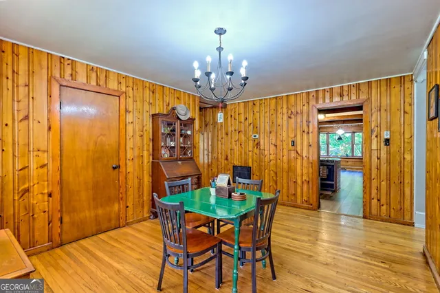 a very nice looking dining room with furniture and wooden floor