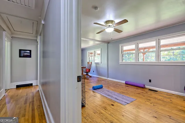 a bedroom with a bed window and a desk