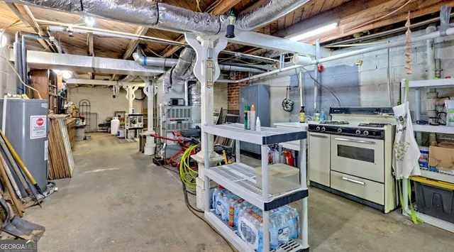a view of a field with a lush green forest