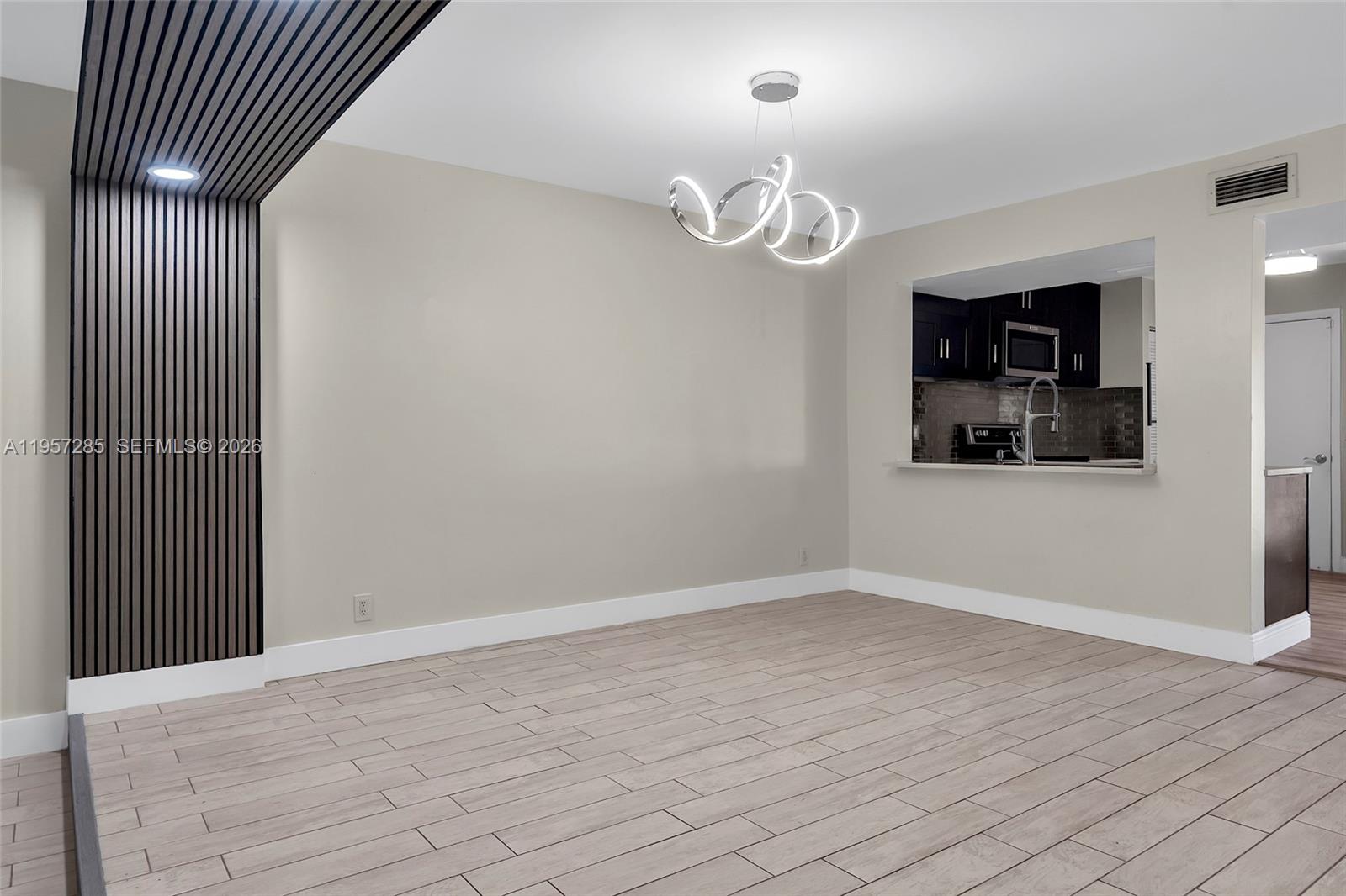 6768 Canary Palm Circle Boca Raton, FL 33433 - Photo 12 of 39 an empty room with wooden floor and window