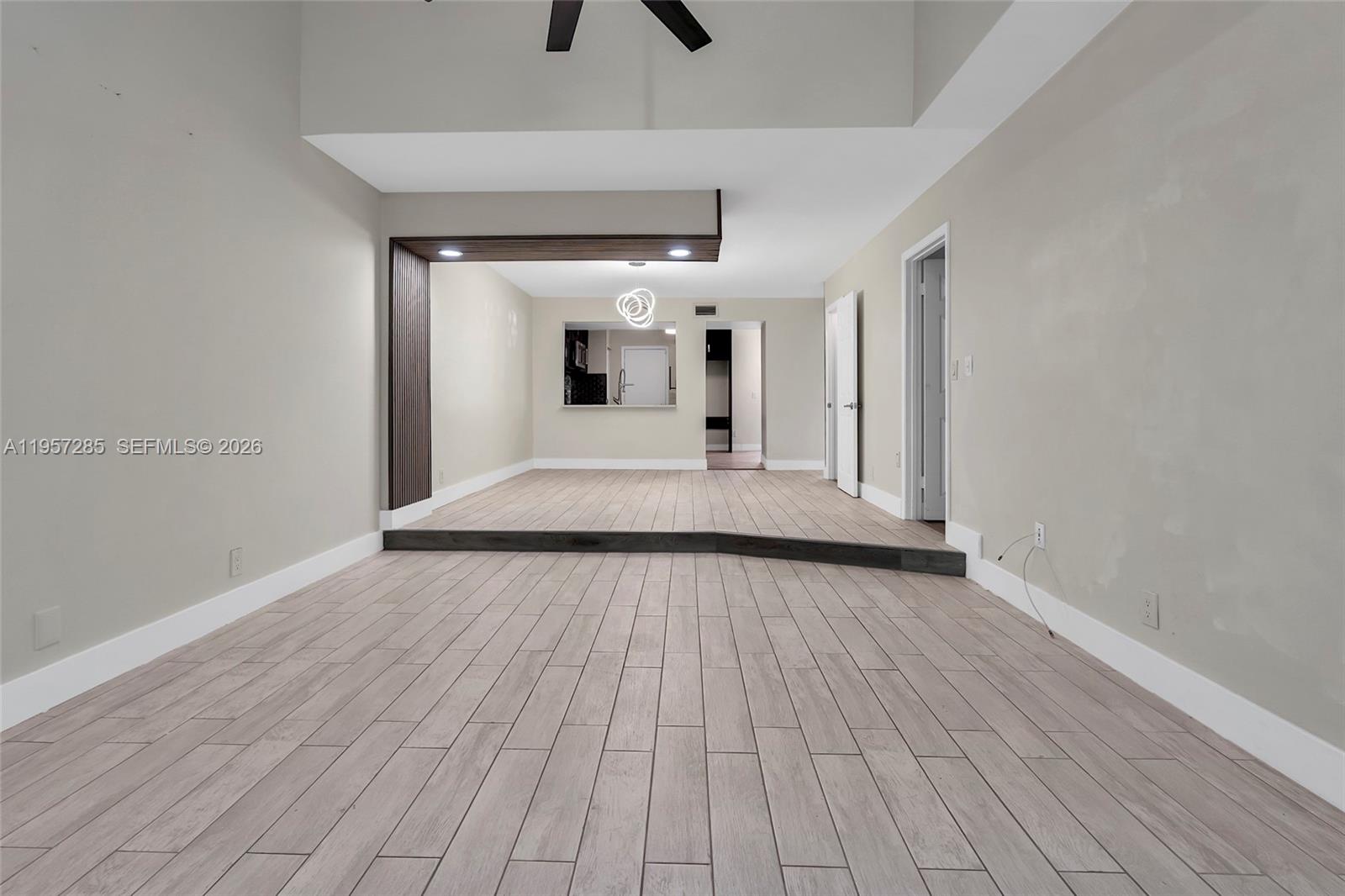 6768 Canary Palm Circle Boca Raton, FL 33433 - Photo 13 of 39 a view of a living room with wooden floor and ceiling fan