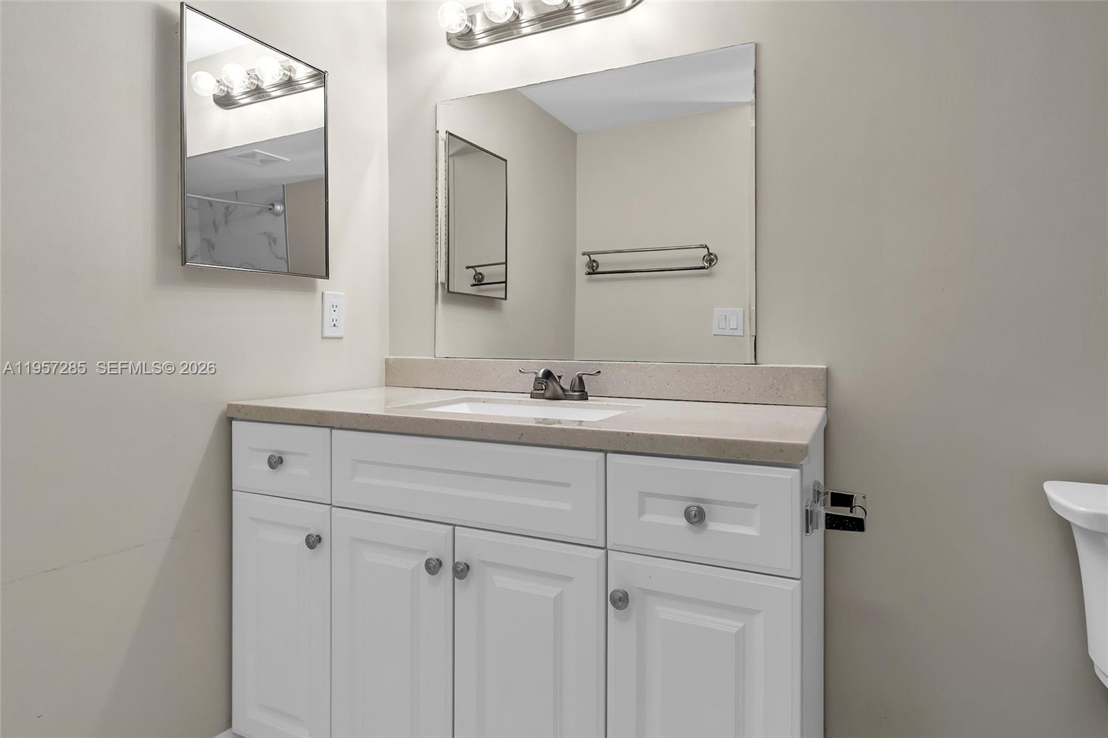 6768 Canary Palm Circle Boca Raton, FL 33433 - Photo 15 of 39 a bathroom with a sink and a mirror