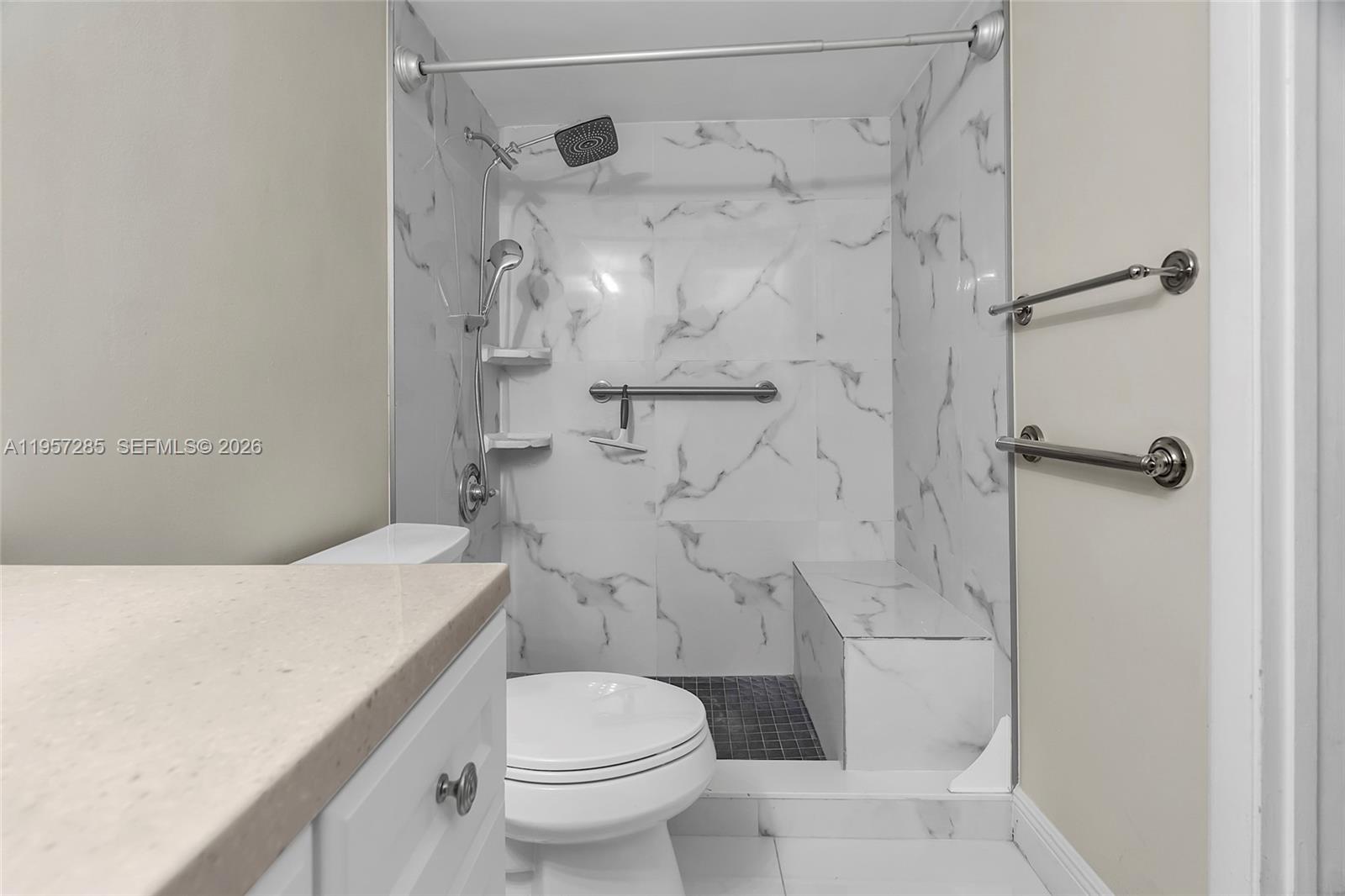 6768 Canary Palm Circle Boca Raton, FL 33433 - Photo 16 of 39 a bathroom with a sink toilet and shower