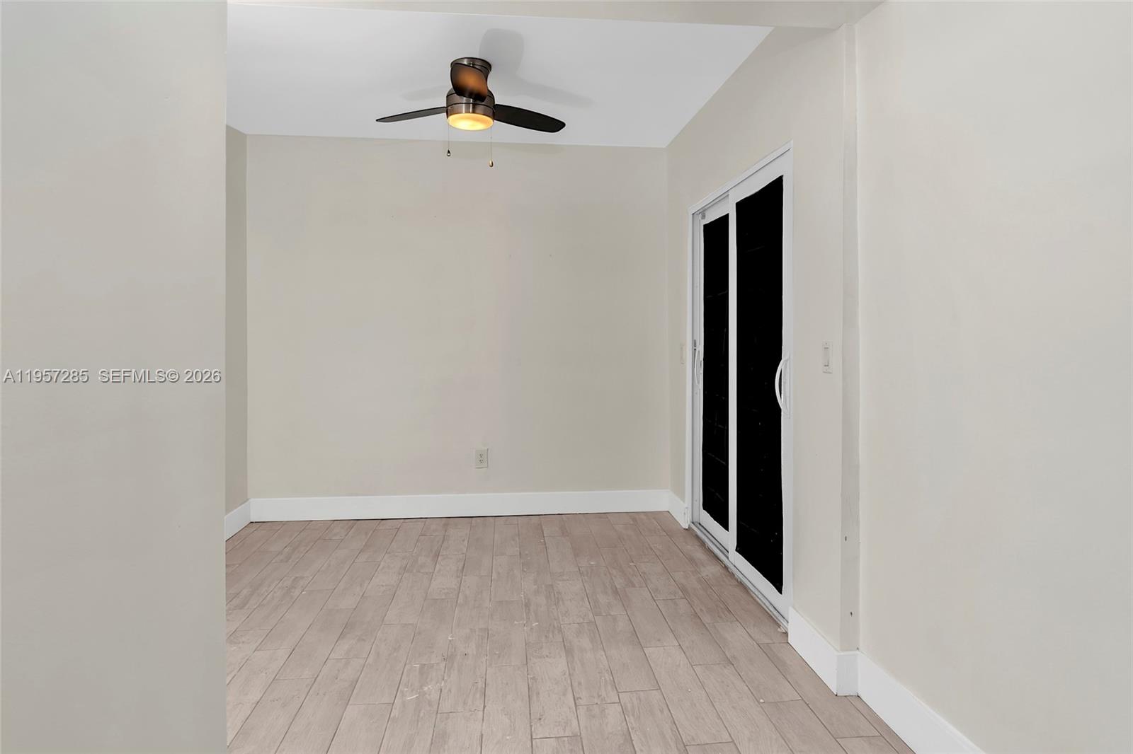 6768 Canary Palm Circle Boca Raton, FL 33433 - Photo 18 of 39 a view of an empty room with wooden floor