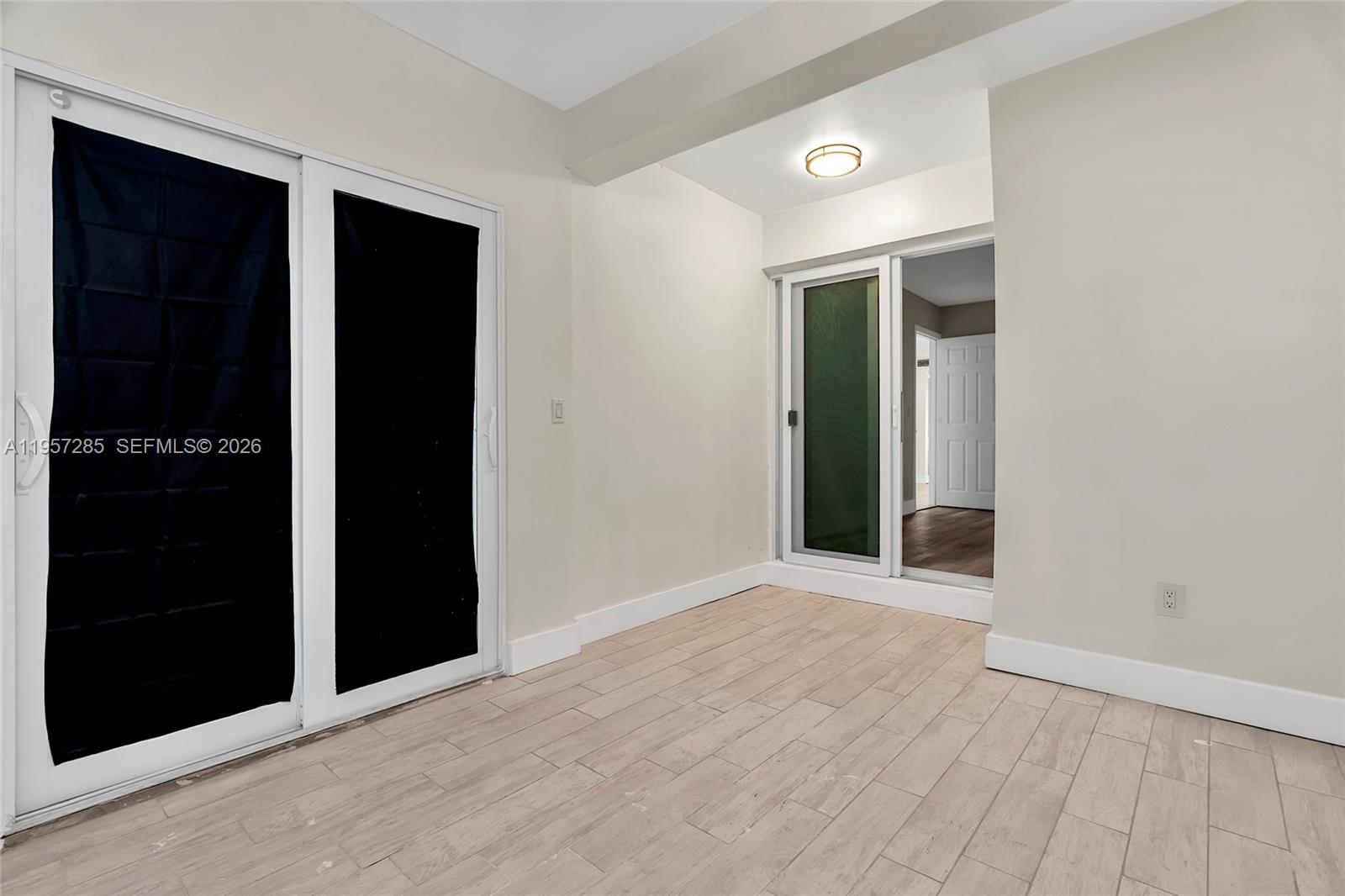 6768 Canary Palm Circle Boca Raton, FL 33433 - Photo 19 of 39 wooden floor in an empty room
