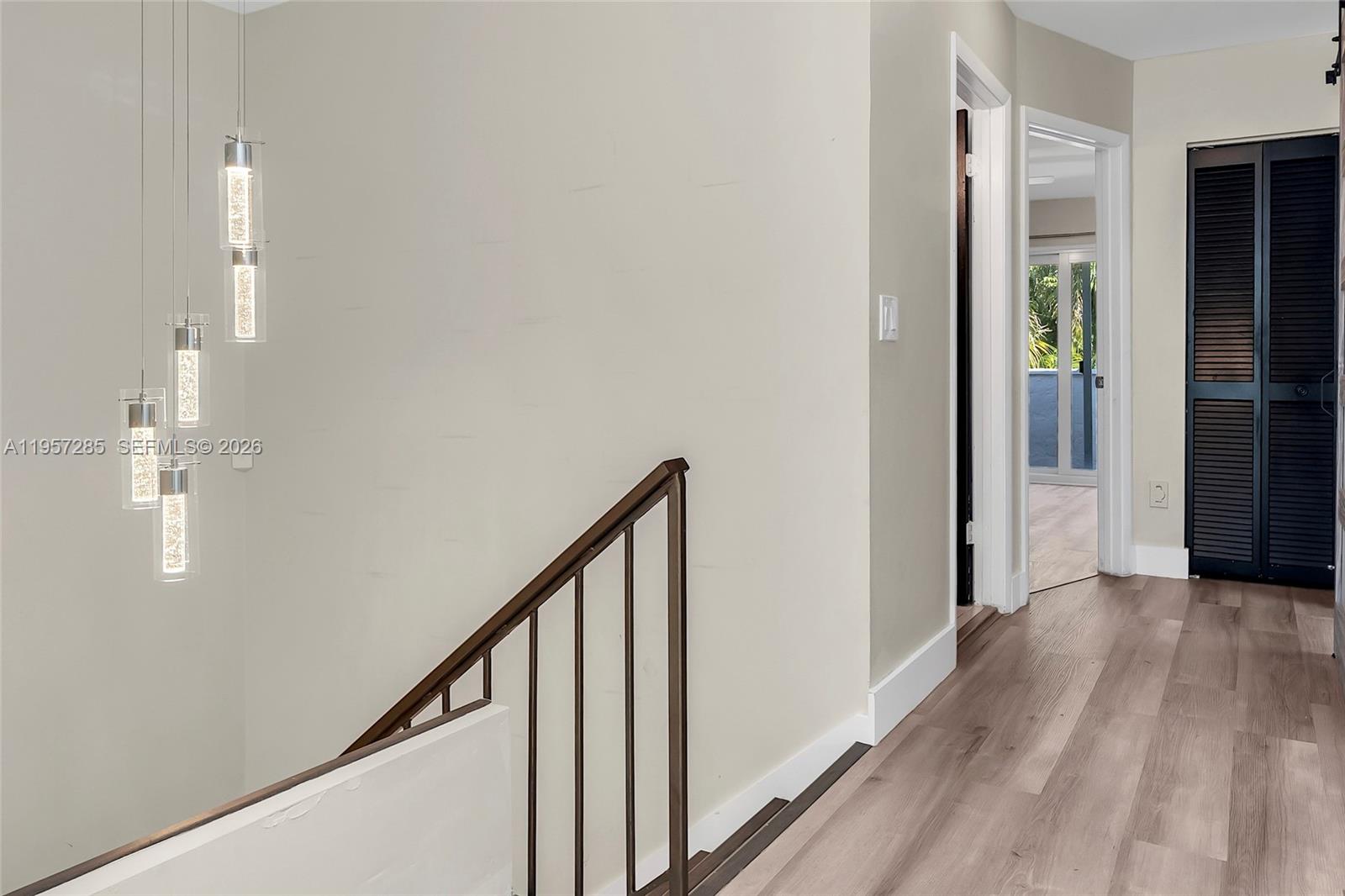 6768 Canary Palm Circle Boca Raton, FL 33433 - Photo 20 of 39 a view of a hallway with wooden floor and staircase