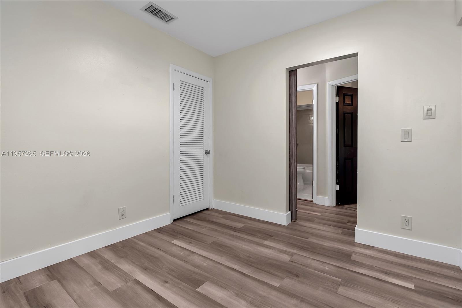 6768 Canary Palm Circle Boca Raton, FL 33433 - Photo 23 of 39 a view of a room with wooden floor and closet