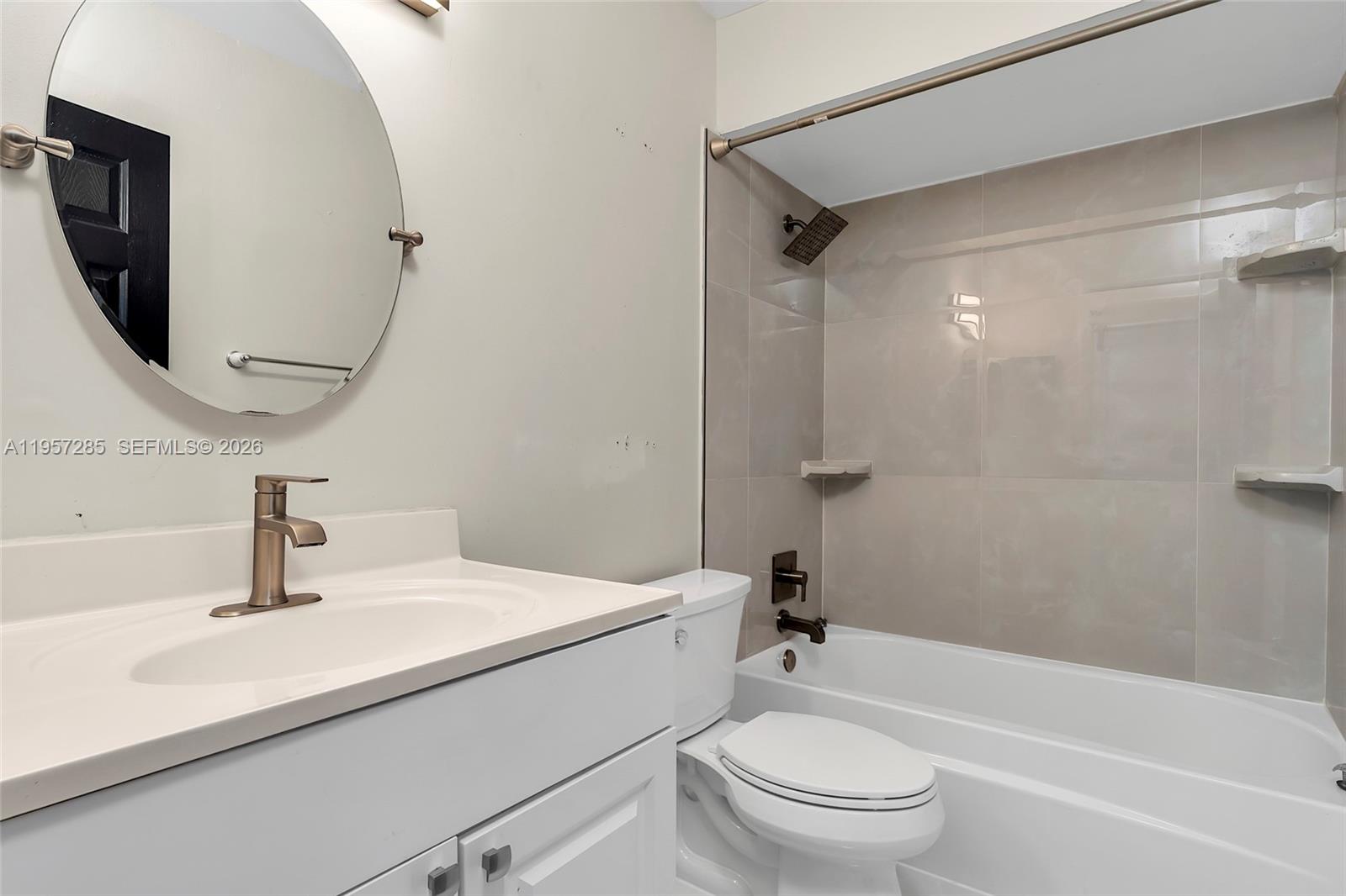 6768 Canary Palm Circle Boca Raton, FL 33433 - Photo 24 of 39 a bathroom with a sink a toilet and shower
