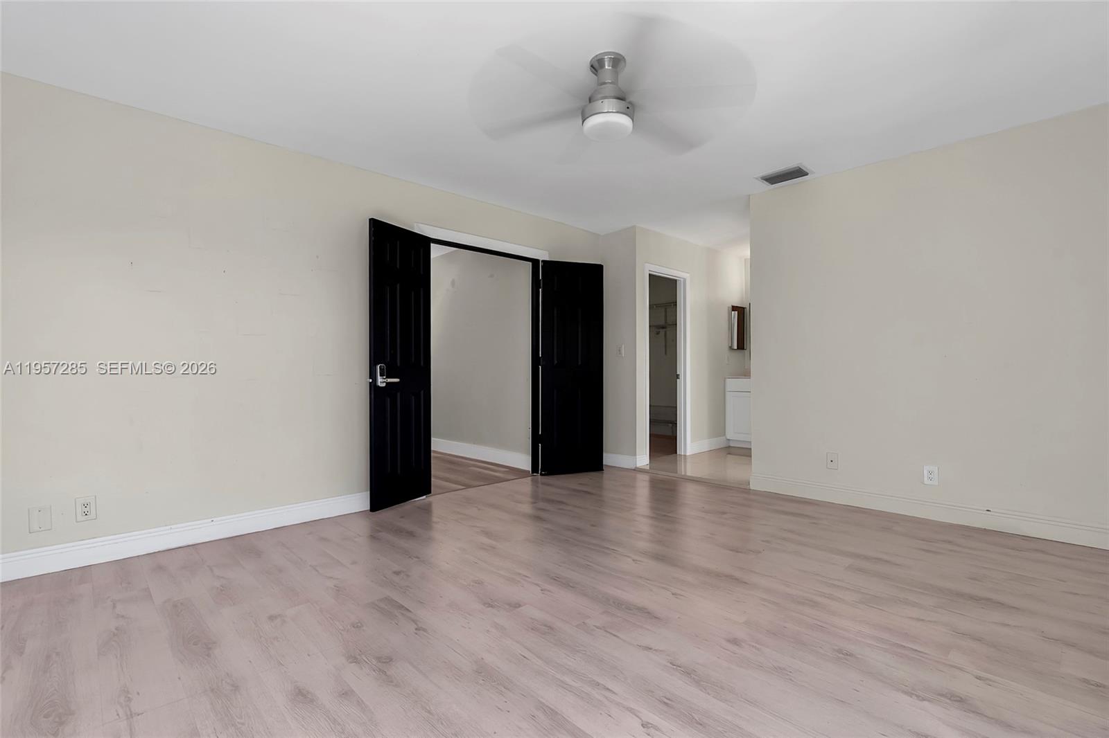 6768 Canary Palm Circle Boca Raton, FL 33433 - Photo 27 of 39 a view of an empty room with wooden floor