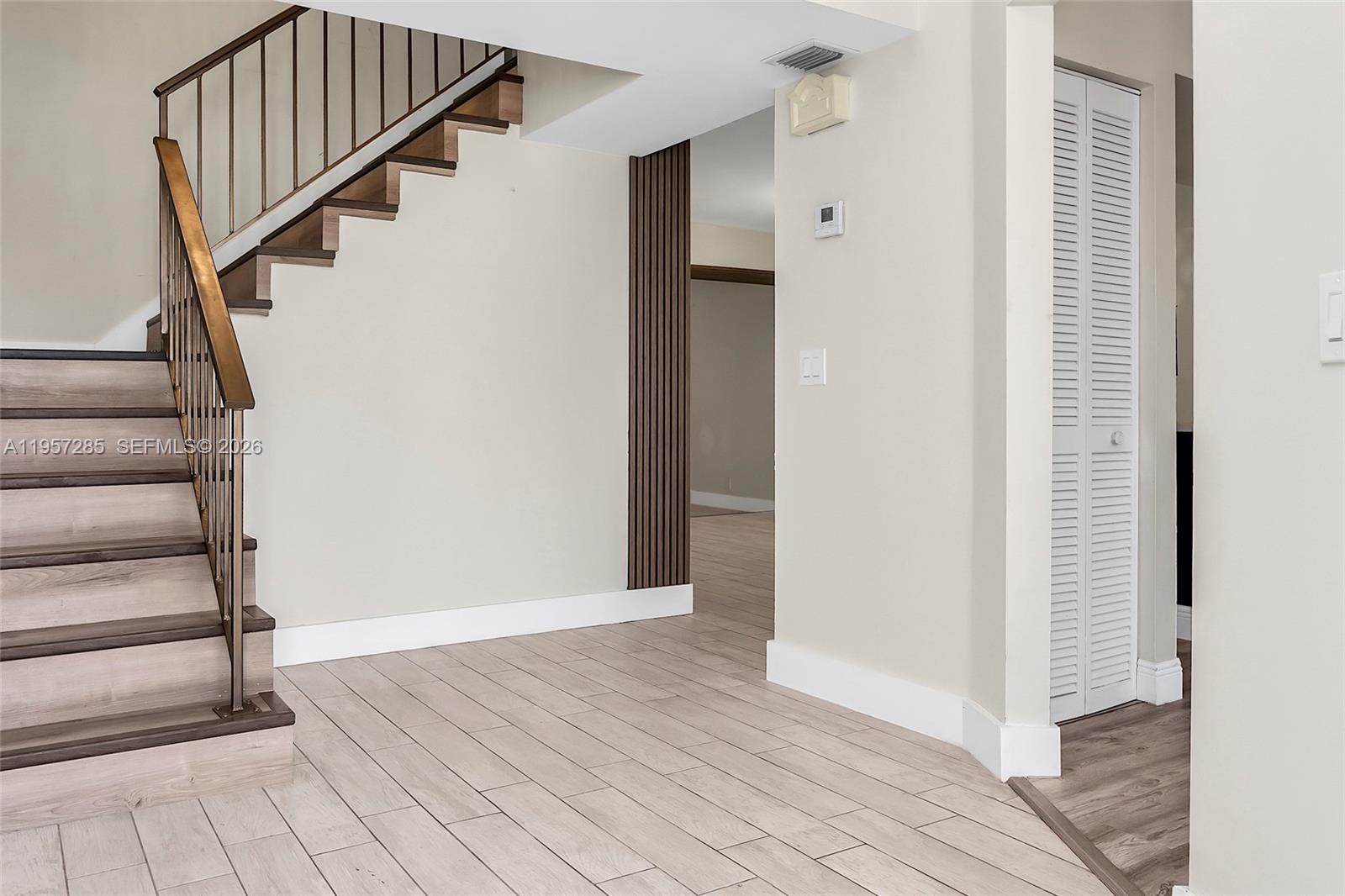 6768 Canary Palm Circle Boca Raton, FL 33433 - Photo 4 of 39 a view of entryway with wooden floor and stairs