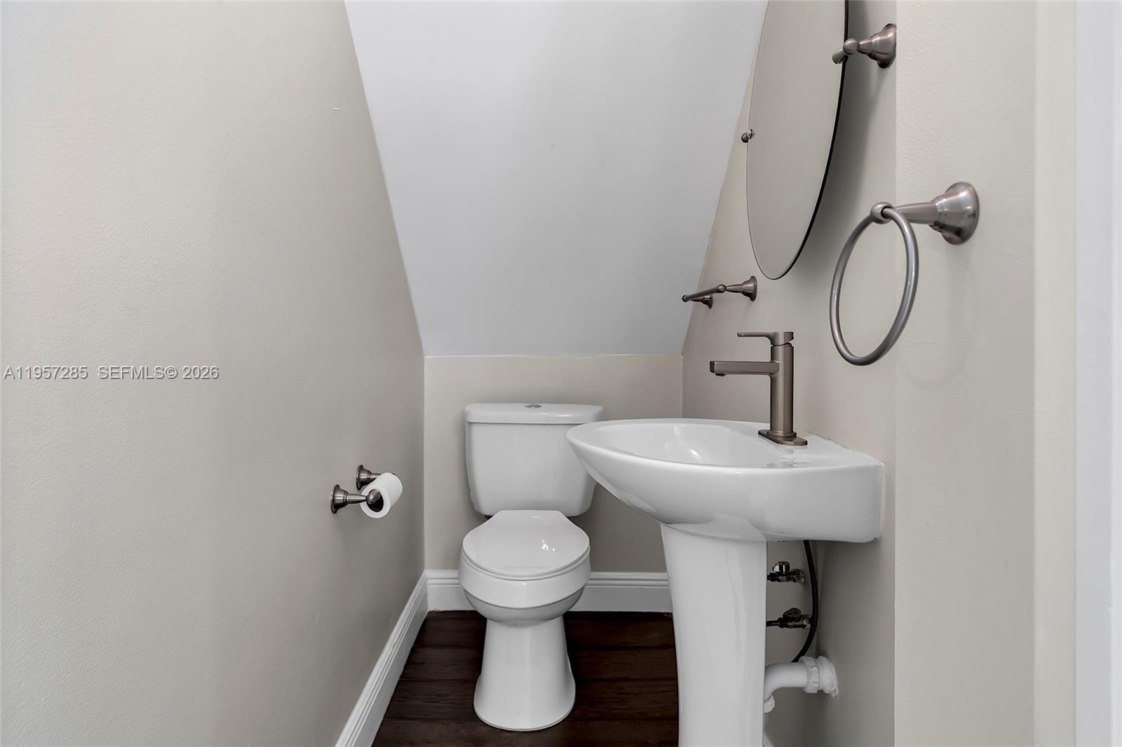 6768 Canary Palm Circle Boca Raton, FL 33433 - Photo 10 of 39 a bathroom with a sink toilet and a mirror