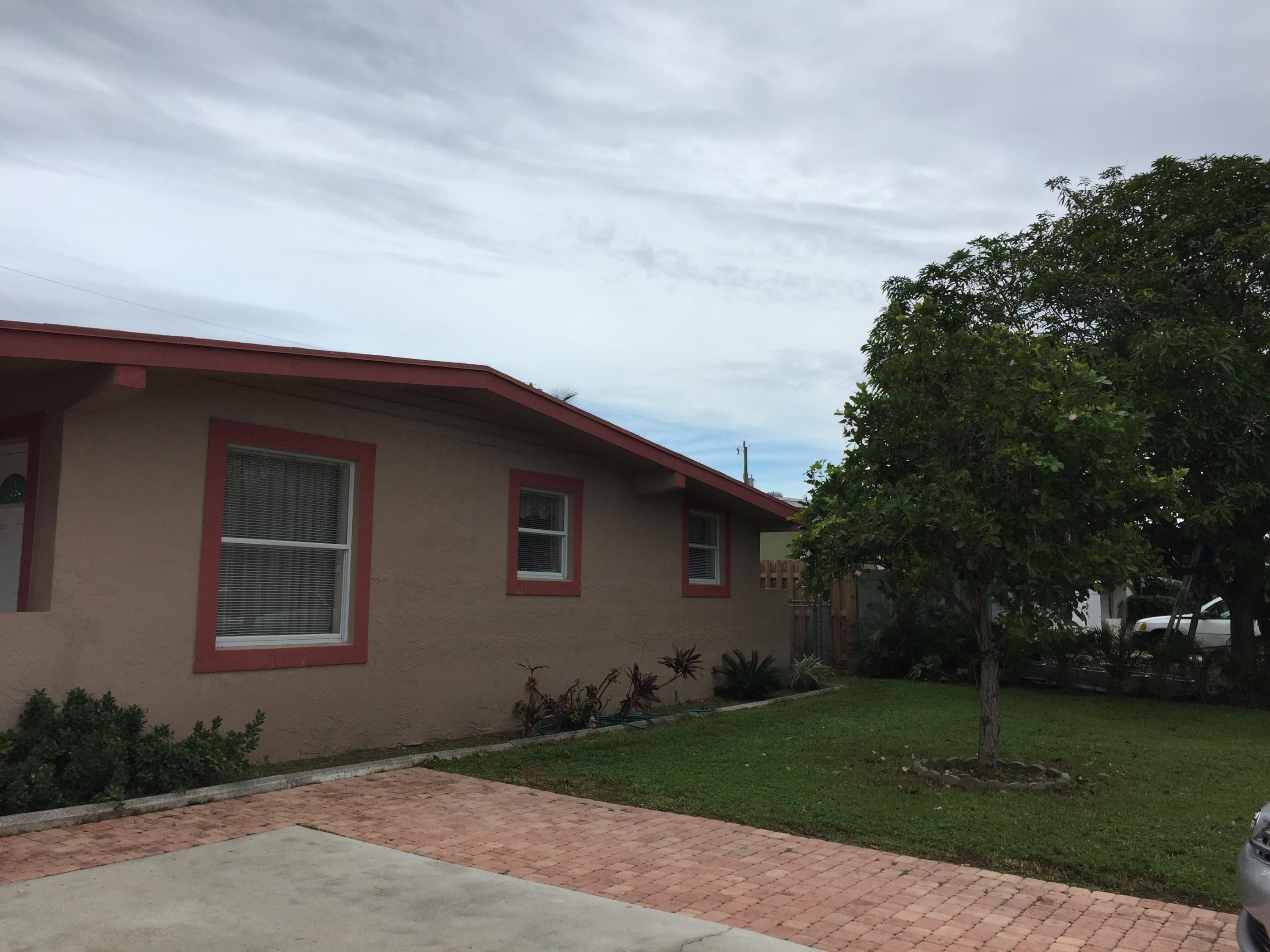 63 Tortuga Road Palm Springs, FL 33461 - Photo 1 of 22 Front