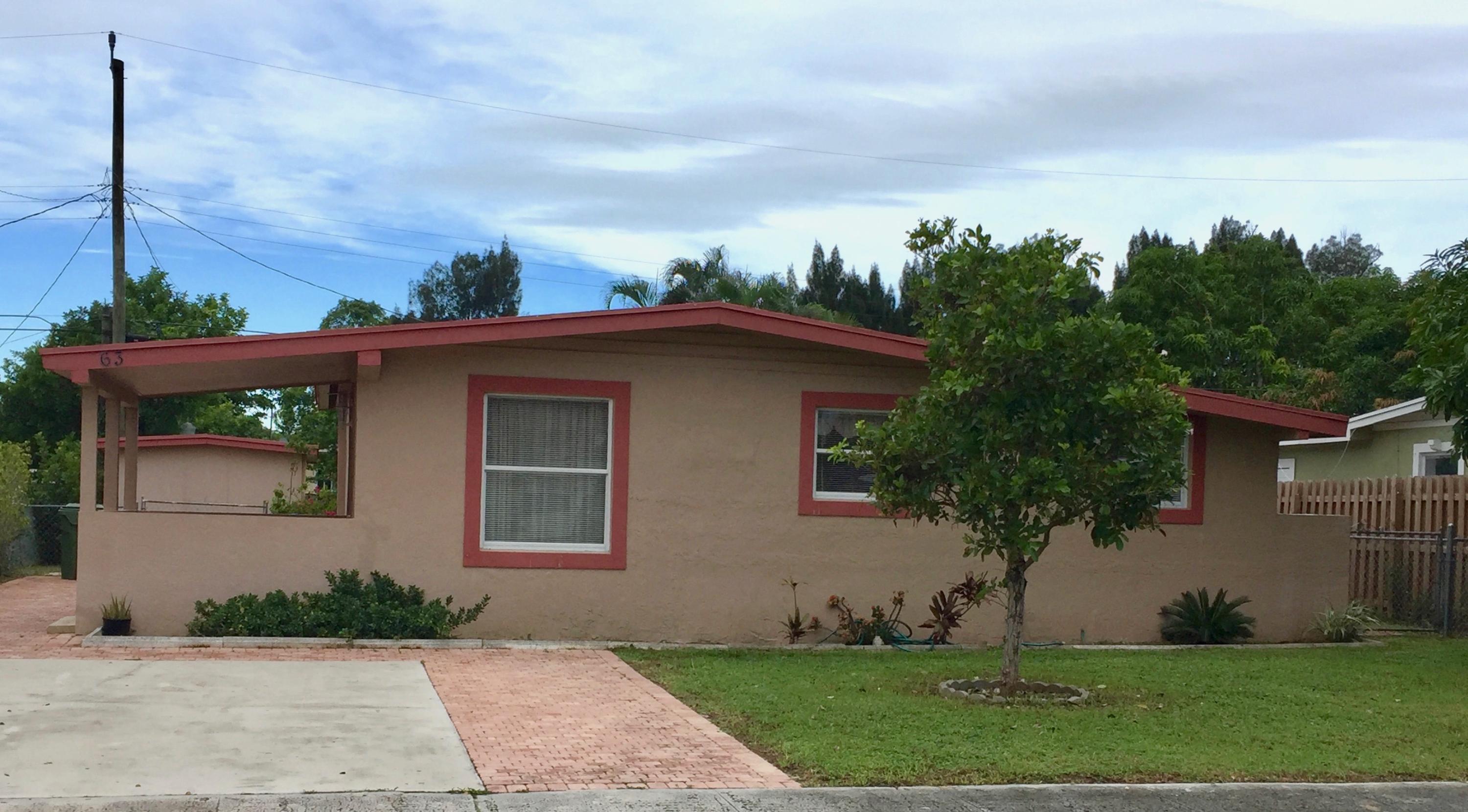 63 Tortuga Road Palm Springs, FL 33461 - Photo 2 of 22 Front