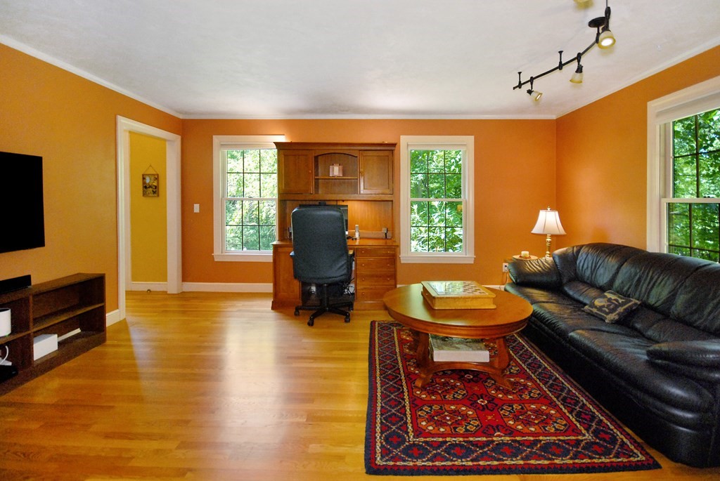 71 Whitcomb Road Boxborough, MA 01719 - Photo 12 of 31 a living room with furniture and a flat screen tv