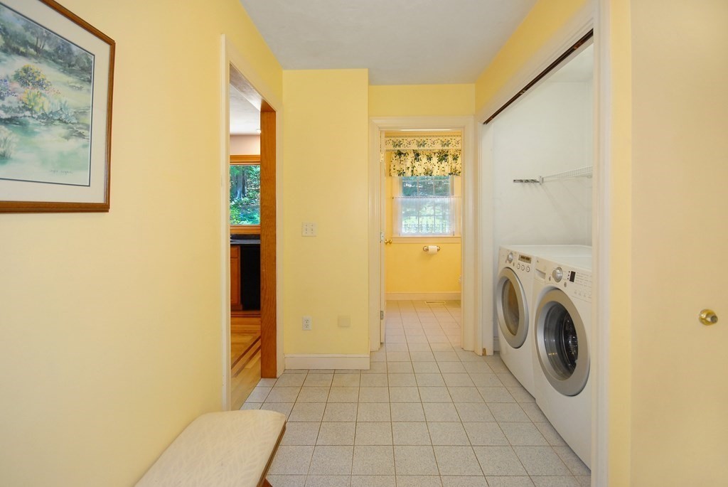71 Whitcomb Road Boxborough, MA 01719 - Photo 16 of 31 a view of a hallway with washer and dryer
