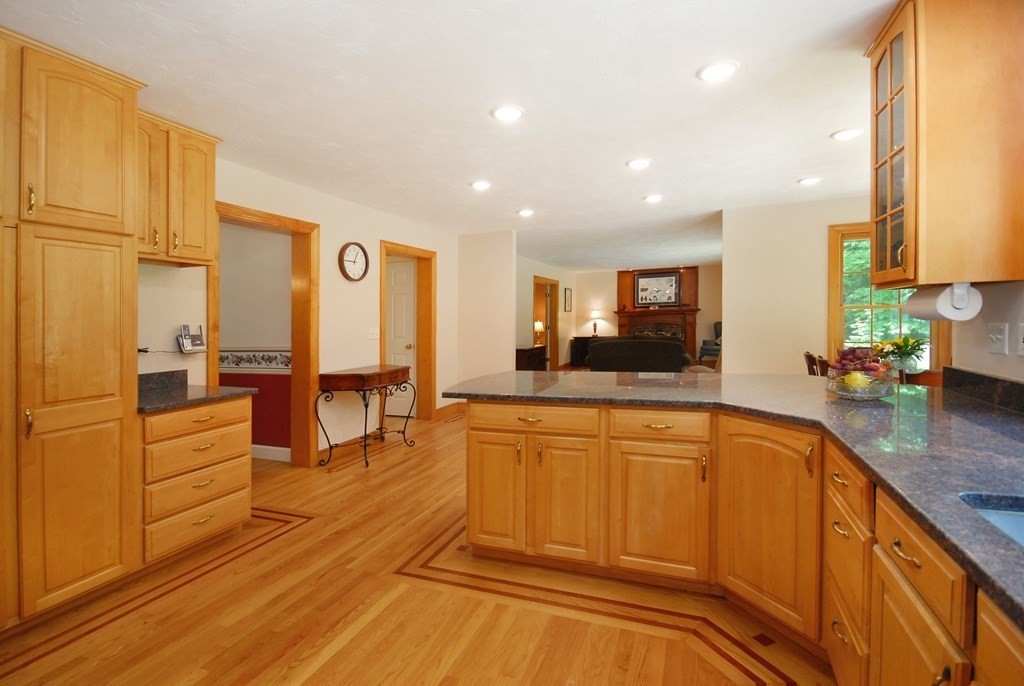 71 Whitcomb Road Boxborough, MA 01719 - Photo 4 of 31 a large kitchen with stainless steel appliances lots of counter space and a sink