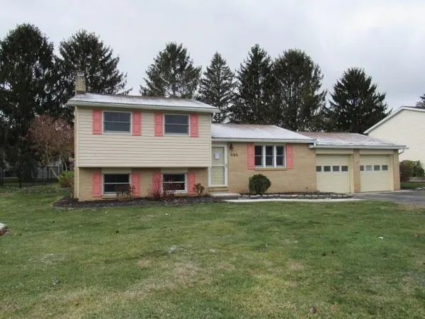 a view of a house with a yard