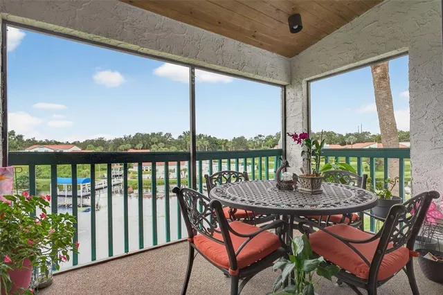a outdoor dining space with furniture and a potted plant