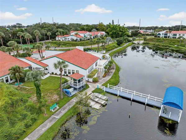 an aerial view of a house with outdoor space