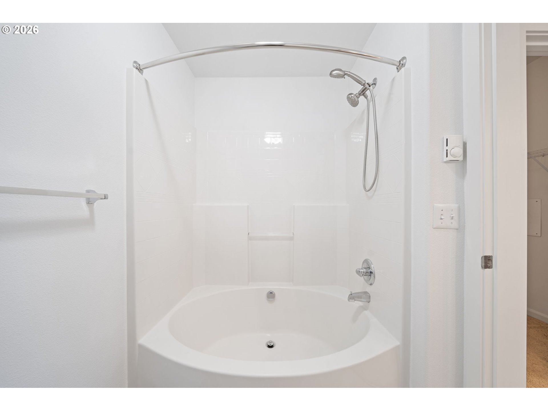 695 Northwest Falling Waters Lane, Unit 304 Portland, OR 97229 - Photo 16 of 25 a bathroom with a white bath tub