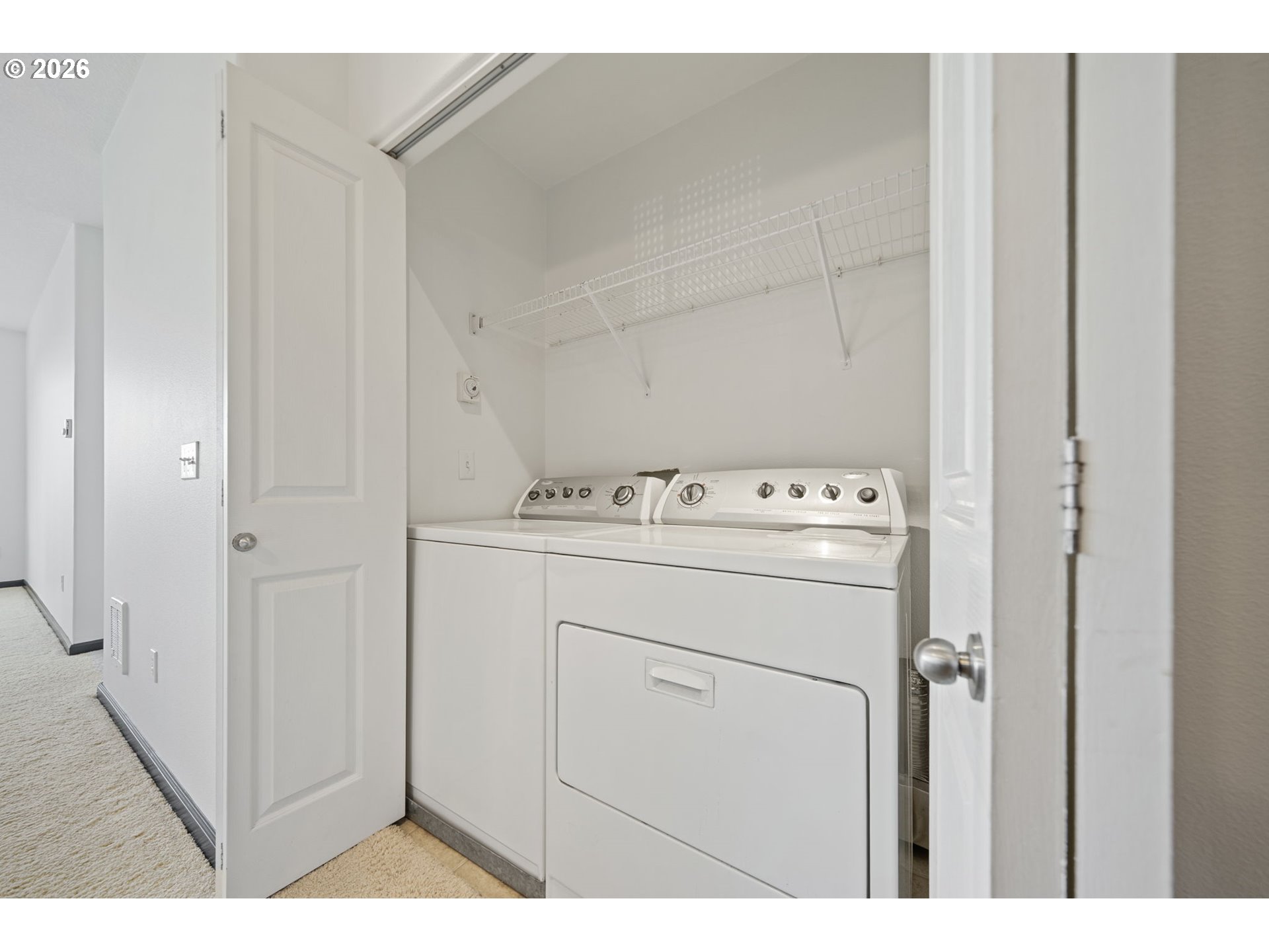 695 Northwest Falling Waters Lane, Unit 304 Portland, OR 97229 - Photo 18 of 25 a utility room with dryer and washer