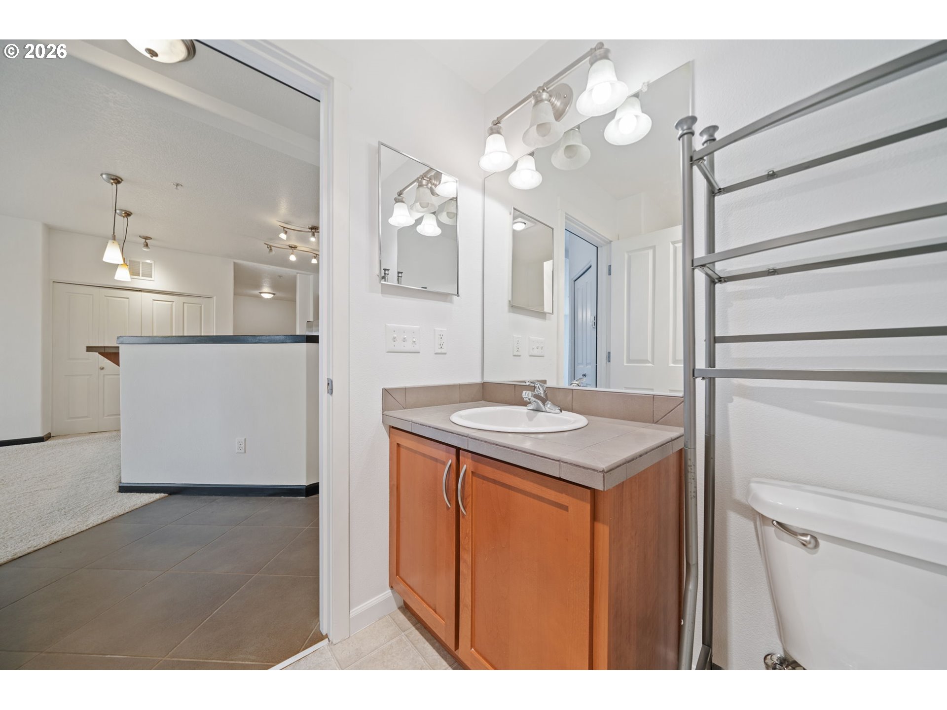 695 Northwest Falling Waters Lane, Unit 304 Portland, OR 97229 - Photo 20 of 25 a kitchen with a sink and cabinets