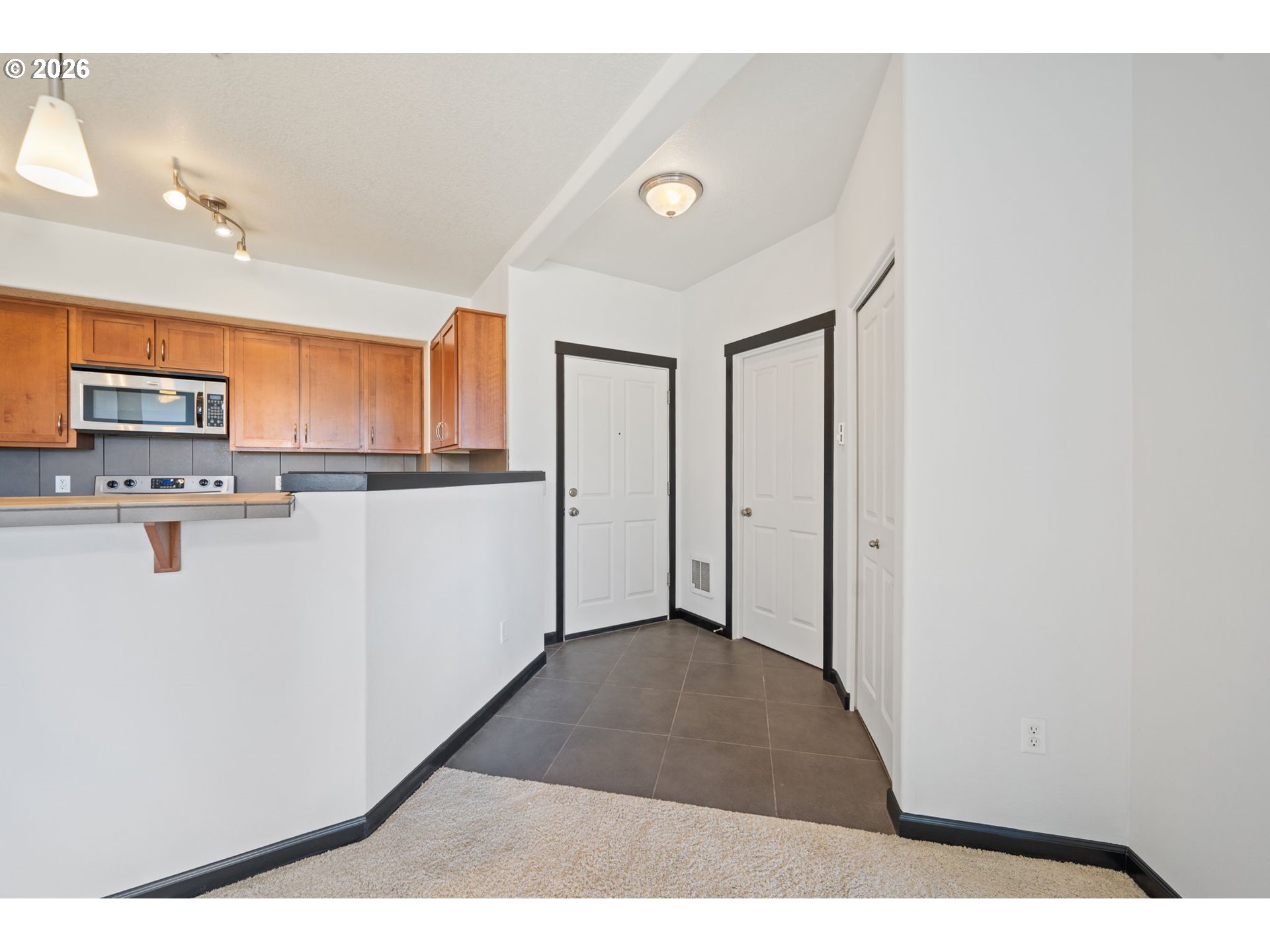 695 Northwest Falling Waters Lane, Unit 304 Portland, OR 97229 - Photo 4 of 25 a view of a kitchen with a sink