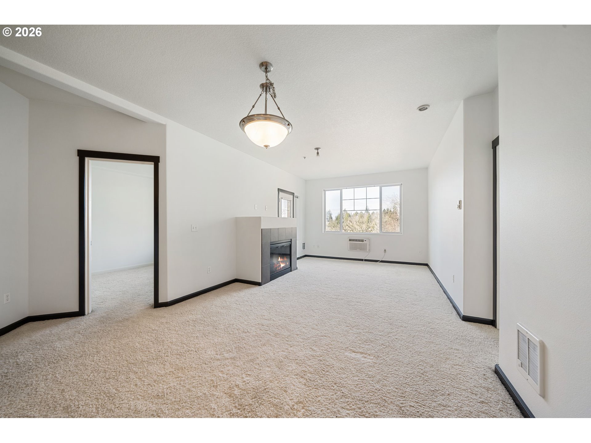 695 Northwest Falling Waters Lane, Unit 304 Portland, OR 97229 - Photo 6 of 25 a view of empty room with windows