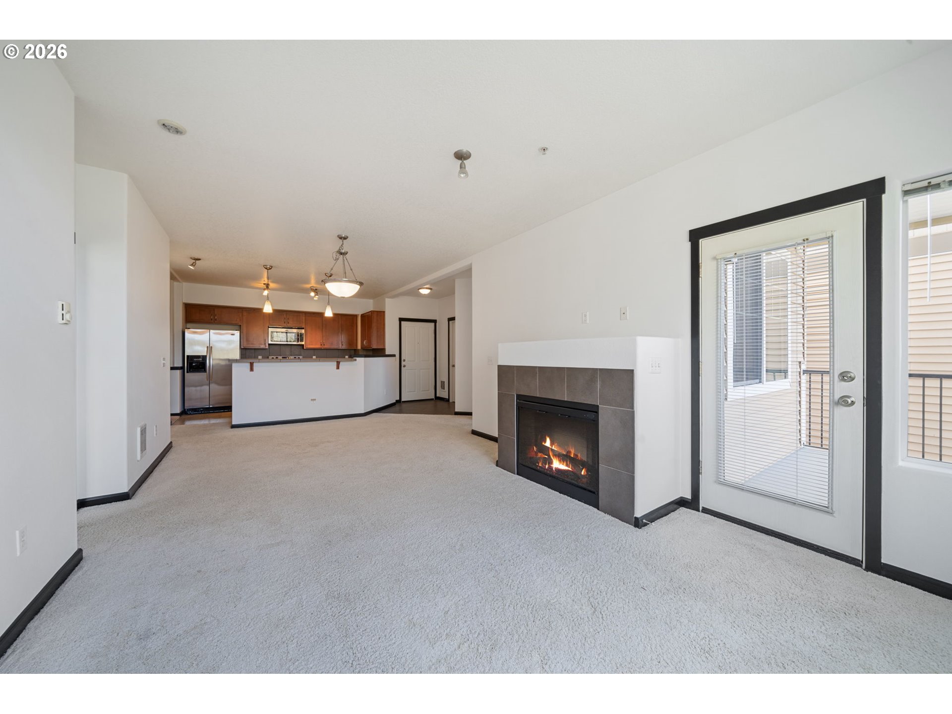 695 Northwest Falling Waters Lane, Unit 304 Portland, OR 97229 - Photo 9 of 25 a view of a livingroom with a fireplace