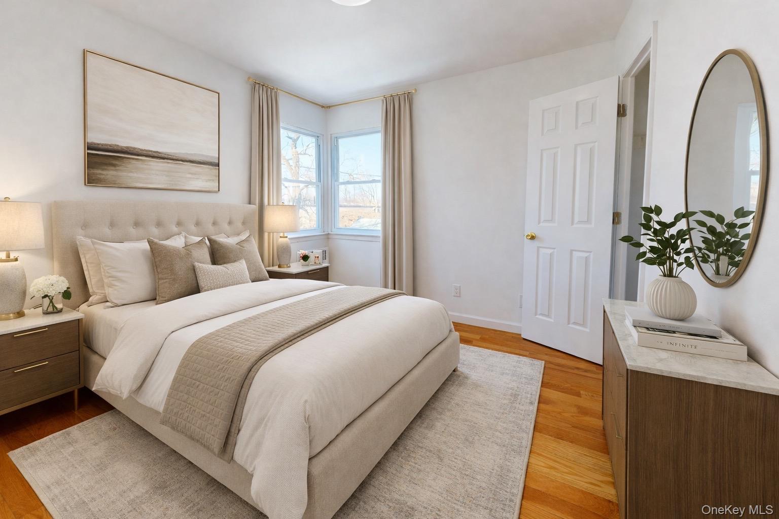 219-42 141st Road Queens, NY 11413 - Photo 4 of 23 a bedroom with bed and wooden floor