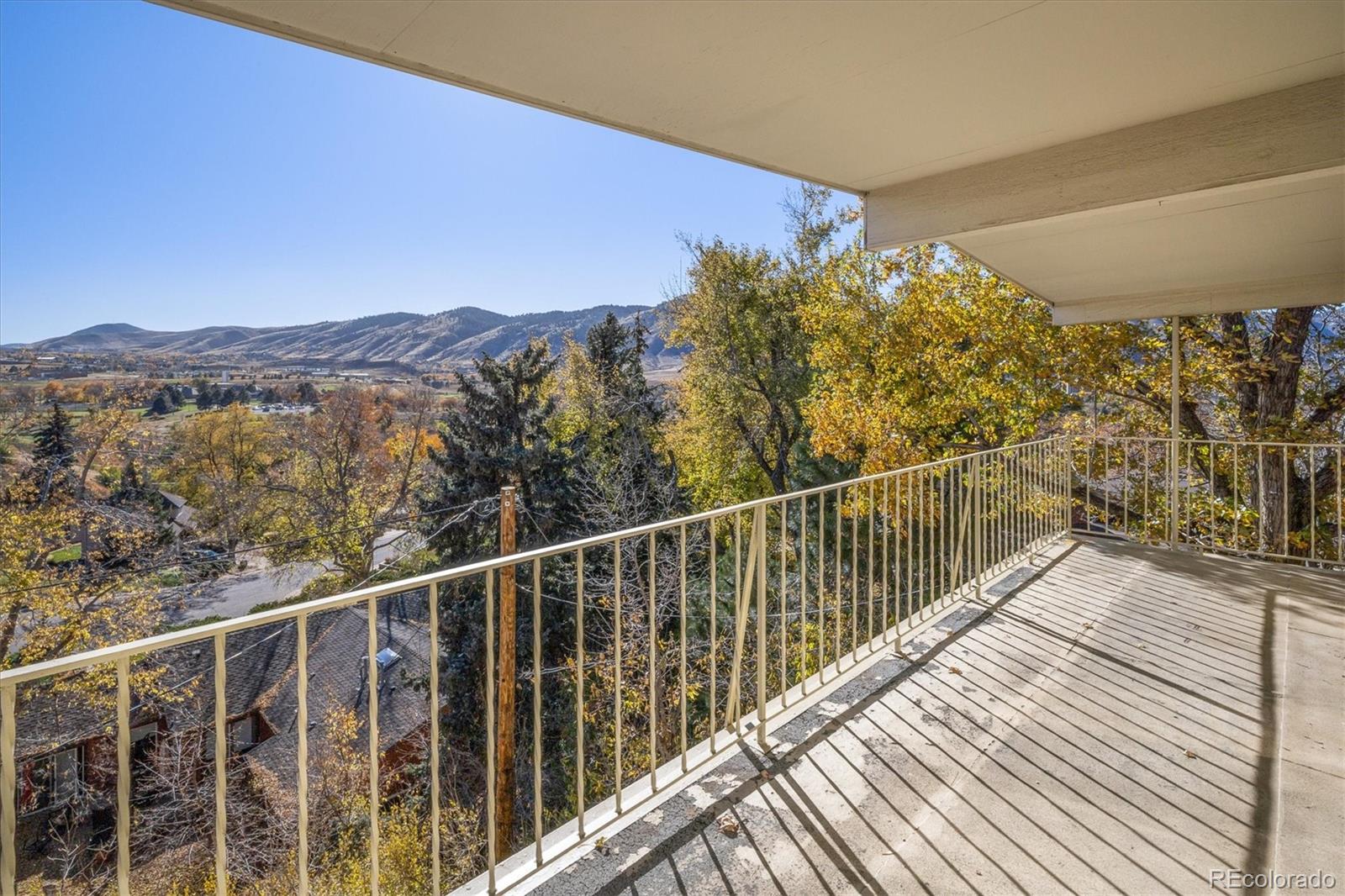 215 Lookout View Court Golden, CO 80401 - Photo 25 of 37 a view of a balcony with wooden fence and floor