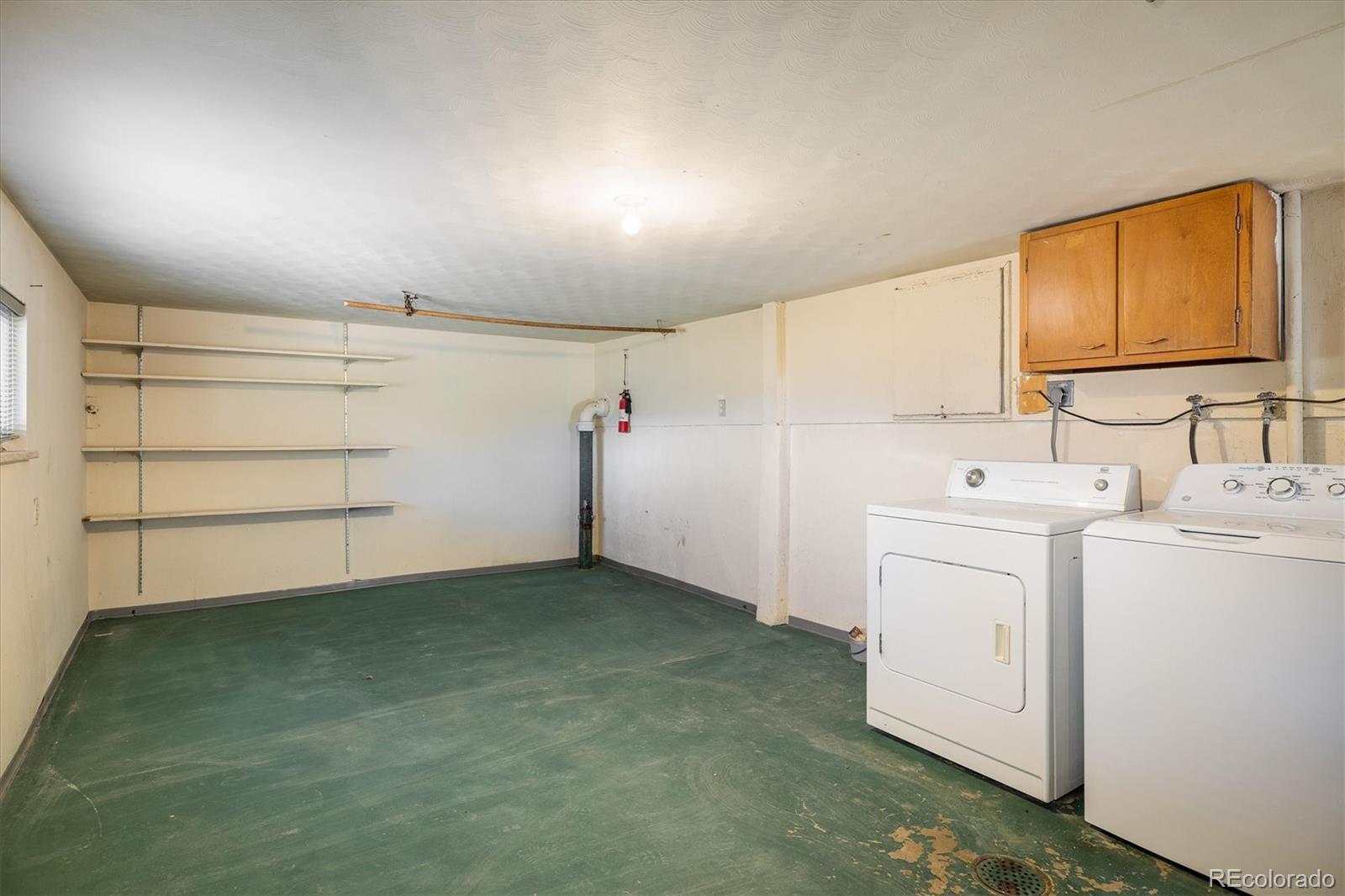 215 Lookout View Court Golden, CO 80401 - Photo 32 of 37 a view of a storage & utility room with closet dryer and washer
