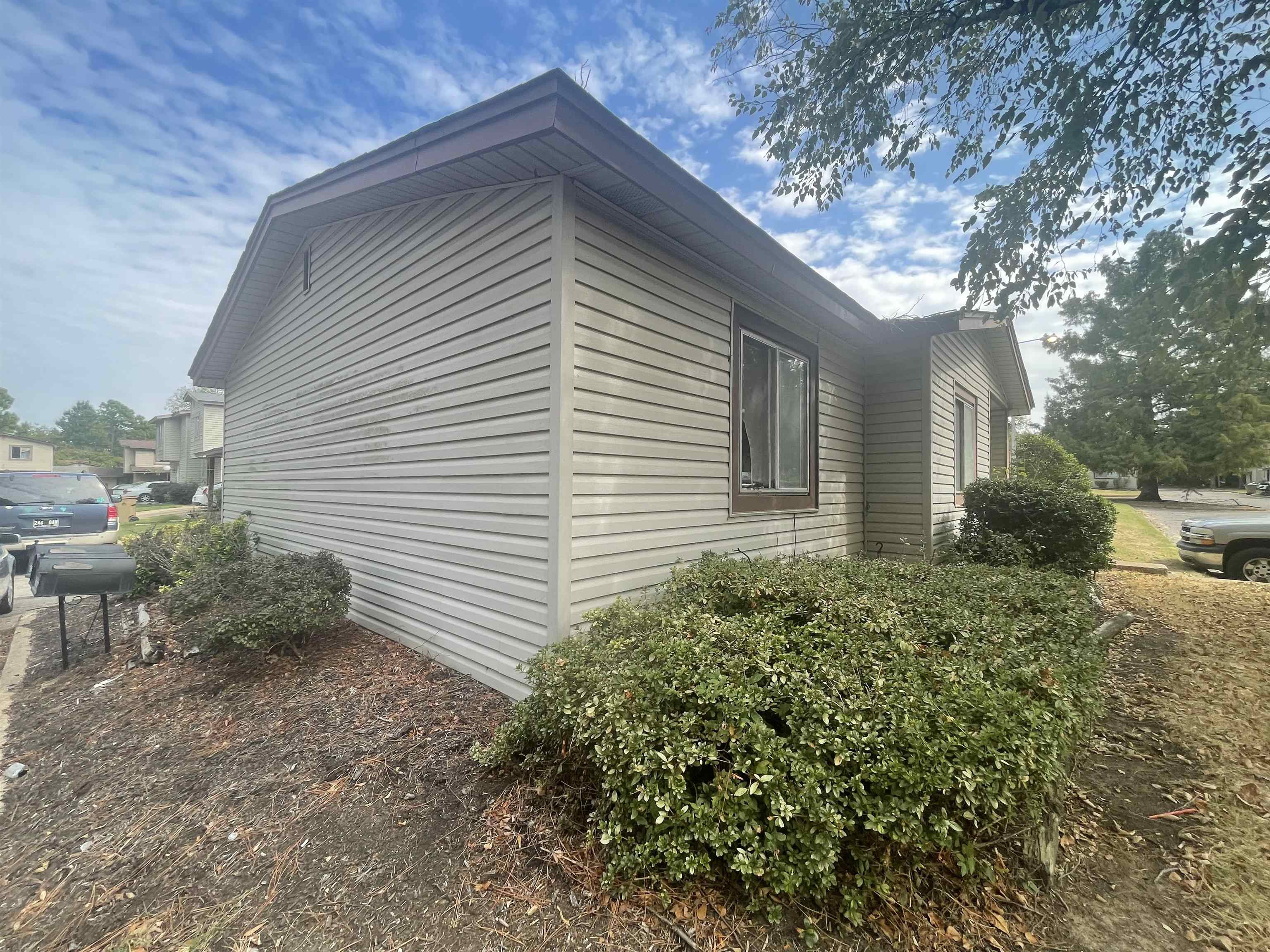 3607 Orange Blossom Court, Unit 66 Memphis, TN 38118 - Photo 3 of 4 a front view of a house with garden