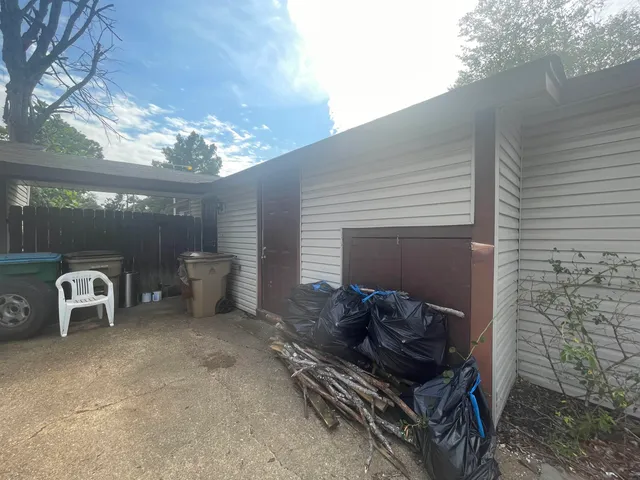 a view of a two chairs in the patio