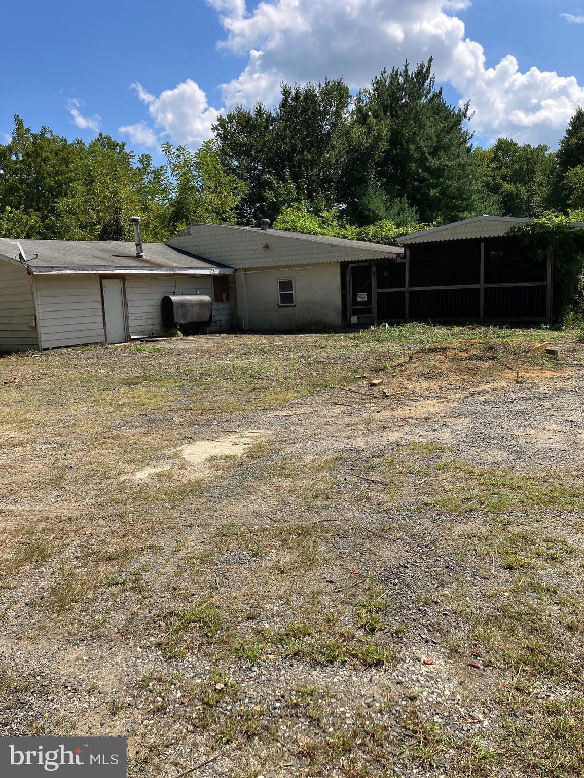 41 New Bridge Road Quinton, NJ 08079 - Photo 2 of 19 a front view of house with yard and trees in the background