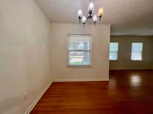 a view of livingroom with hardwood floor and ceiling fan