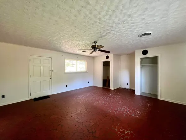a view of empty room with windows