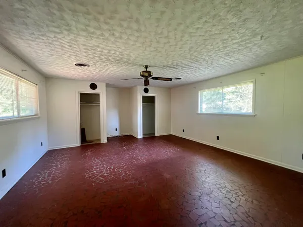 an empty room with windows
