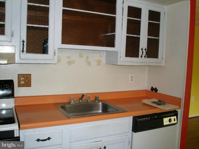 2306 Whitetail Court Reston, VA 20191 - Photo 3 of 8 a view of storage and utility room with washer and dryer