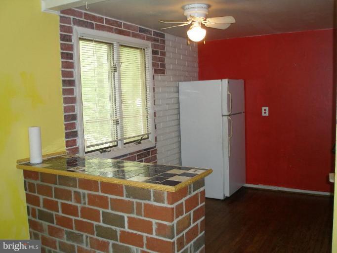 2306 Whitetail Court Reston, VA 20191 - Photo 7 of 8 a bathroom with a granite countertop sink and a mirror